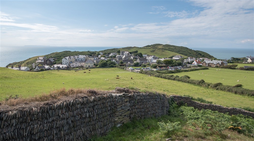 A view across Mortehoe with a stone wall in the foreground, Devon at Cloud Farmhouse in Lynton, Devon