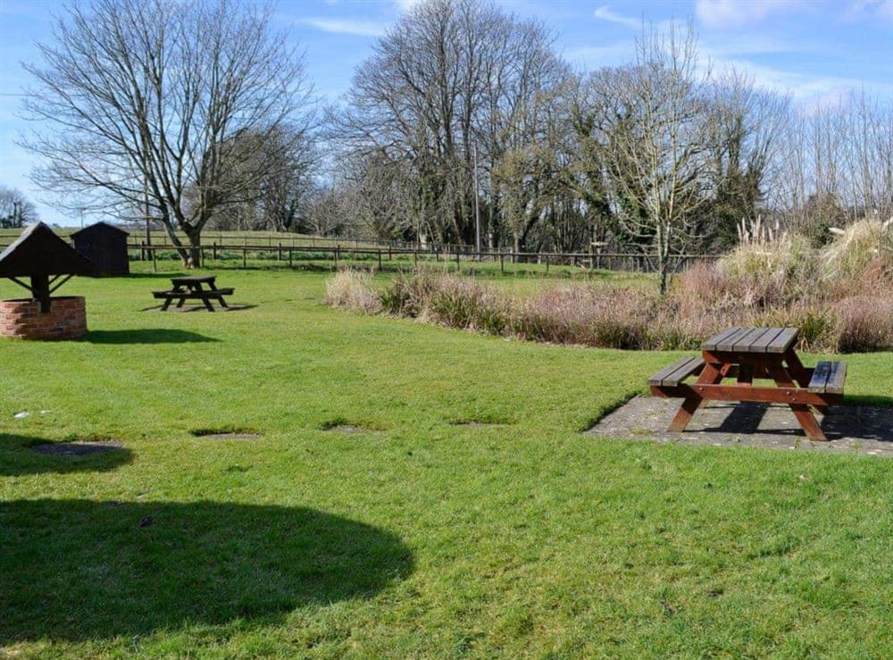 Shared grounds with picnic area at Clouseau Cottage in Lyme Regis, Dorset., Great Britain