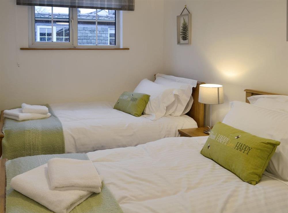 Comfortable twin bedroom at Clover Cottage in Keswick, Cumbria