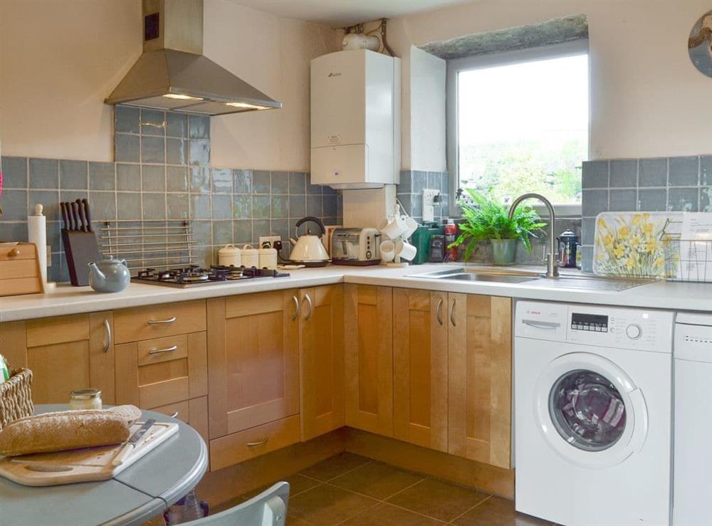Fully equipped kitchen with dining area at Club Houses in Old Town, near Hebden Bridge, West Yorkshire