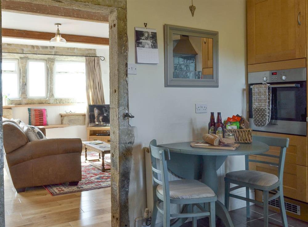 Kitchen with dining area adjoining living and dining room at Club Houses in Old Town, near Hebden Bridge, West Yorkshire