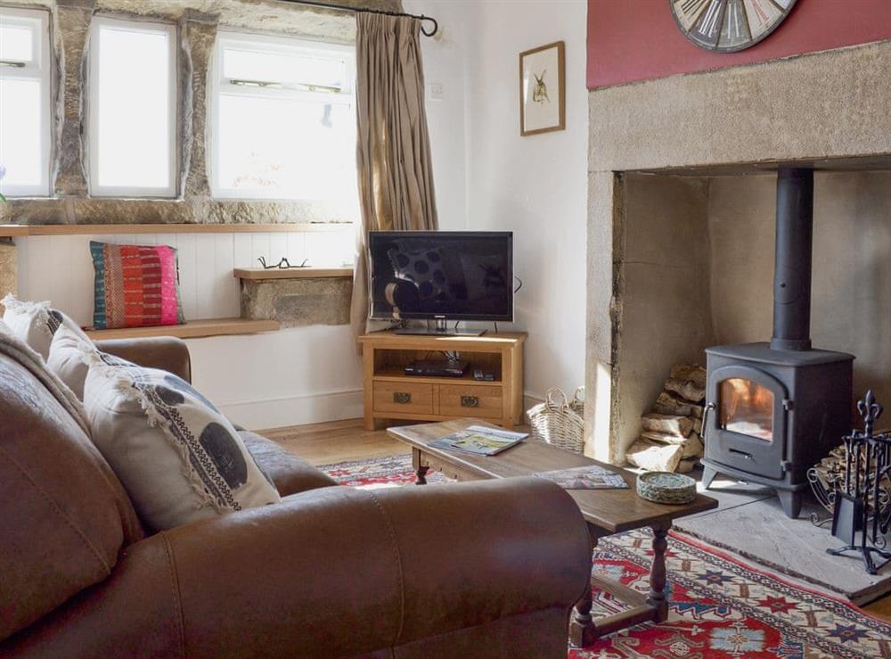 Welcoming living area with wood burner at Club Houses in Old Town, near Hebden Bridge, West Yorkshire