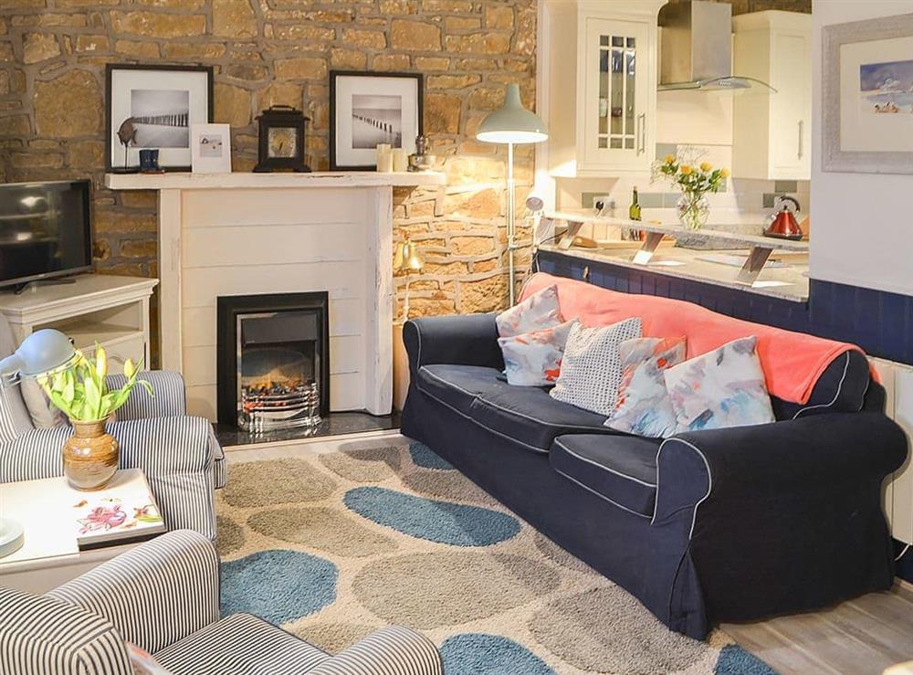 Welcoming living area at Clutter Cottage in Druridge by-the-Sea, Northumberland., Great Britain