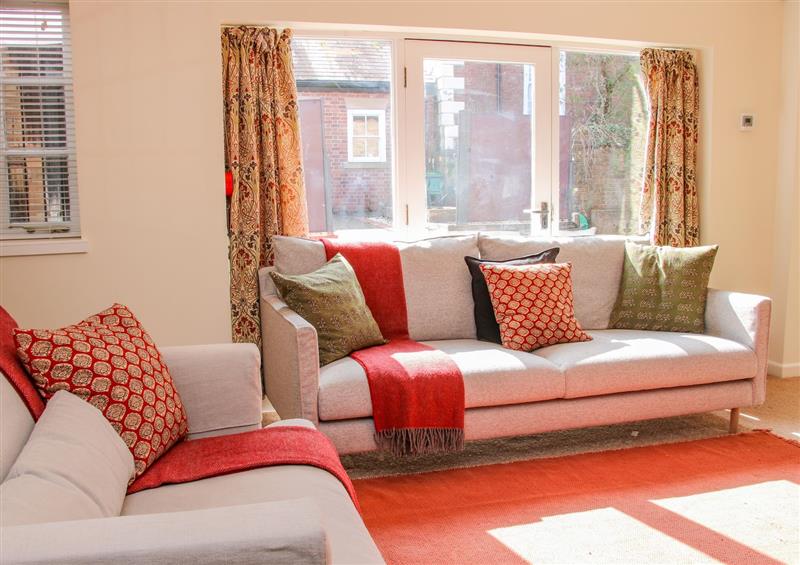 Relax in the living area at Coach House at Old Vicarage, Madeley