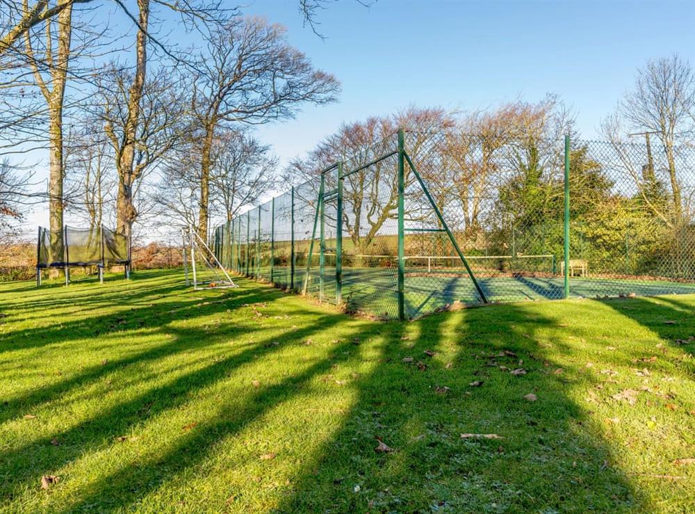 Tennis court at Coach House in Bridgerule, near Bude, Devon