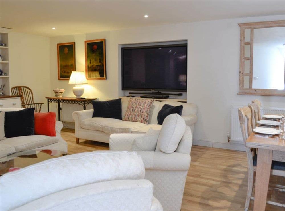 Cosy living room with 65 inch TV (photo 2) at Coach House in Chulmleigh, near South Molton, Devon