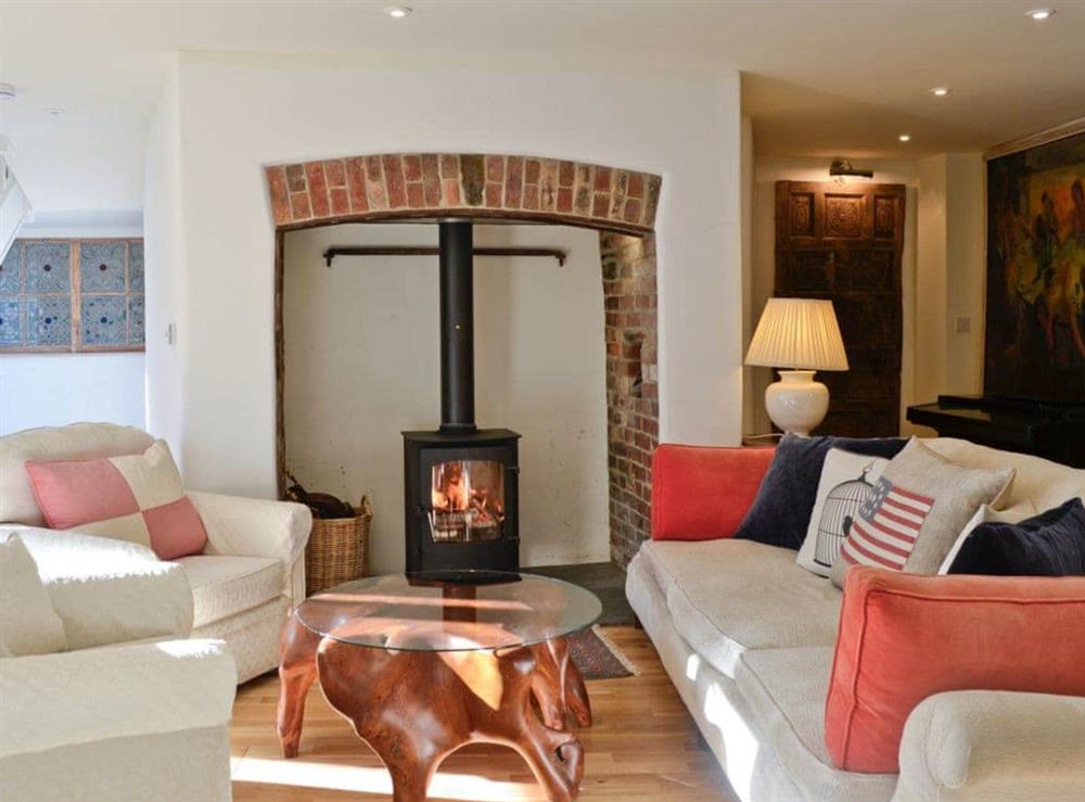 Cosy living room with wood burner (photo 2) at Coach House in Chulmleigh, near South Molton, Devon
