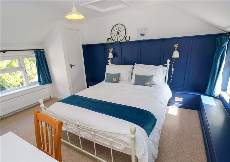 A bedroom in Coach House Cottage at Coach House Cottage, Broad Haven