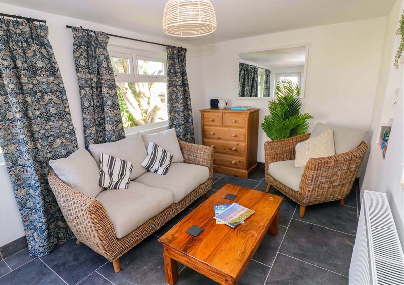 Relax in the living area (photo 2) at Coach House Cottage, Broad Haven