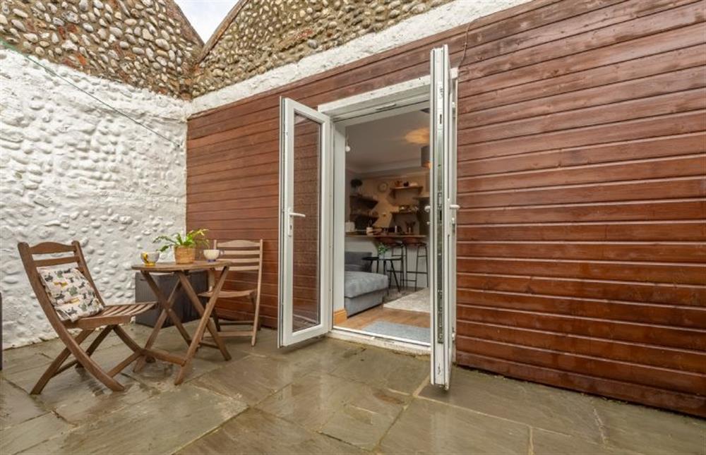 Enclosed courtyard  at Coach House Cottage, Weybourne near Holt