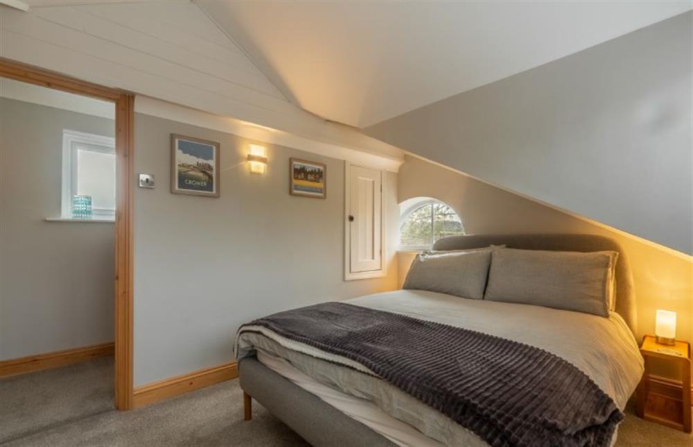 First floor: Bedroom at Coach House Cottage, Weybourne near Holt