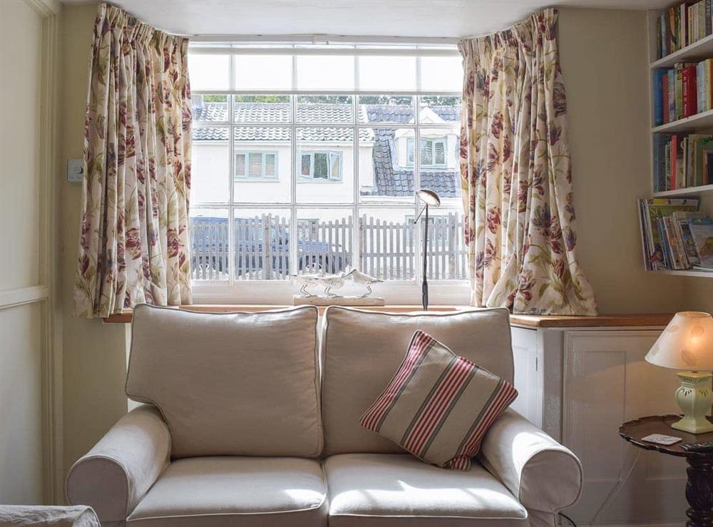 Delightul window seat in the living room at Coach House Cottage, 