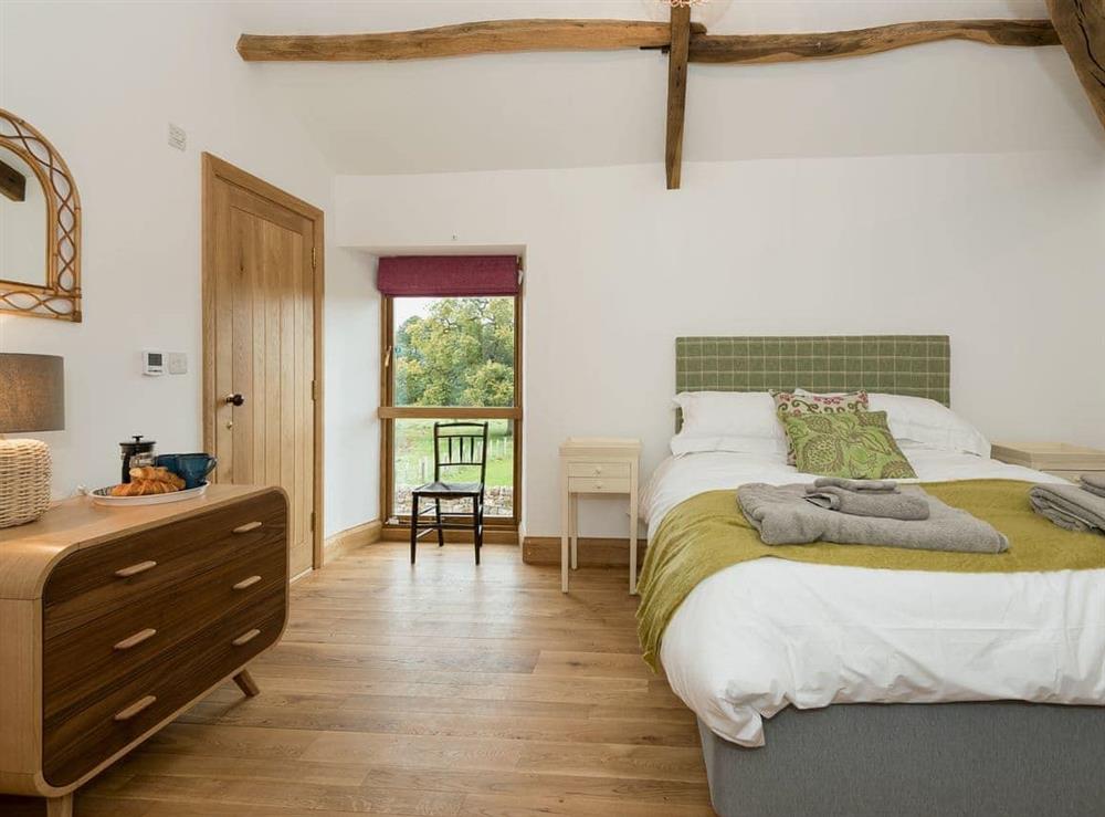 Bed room with kingsize bed and en-suite shower room (photo 2) at Coach House in Greystoke, Cumbria