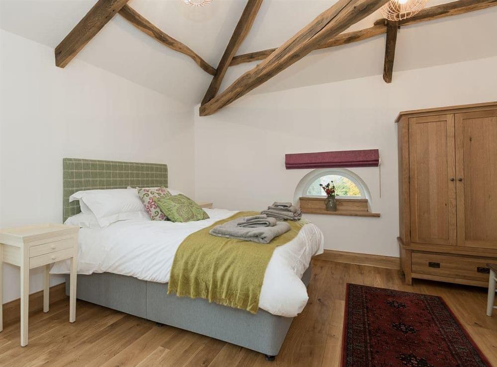 Bed room with kingsize bed and en-suite shower room at Coach House in Greystoke, Cumbria