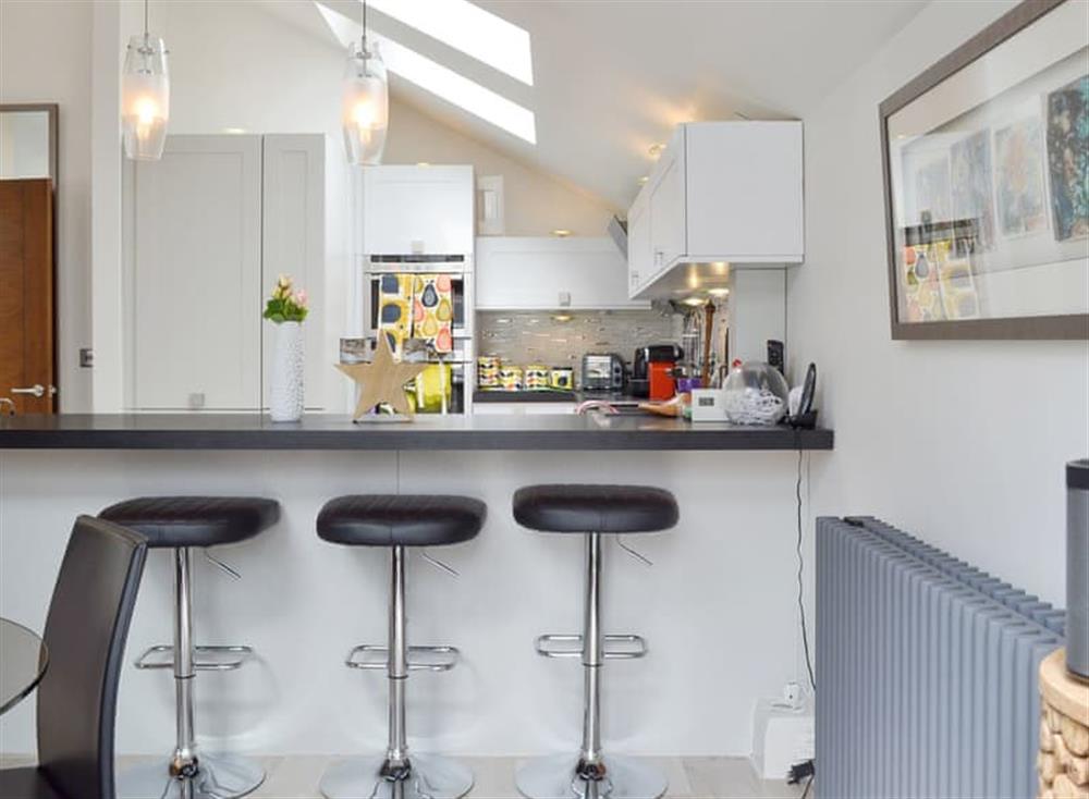Fully appointed kitchen with breakfast bar at Coach House in Lytham St Annes, Lancashire