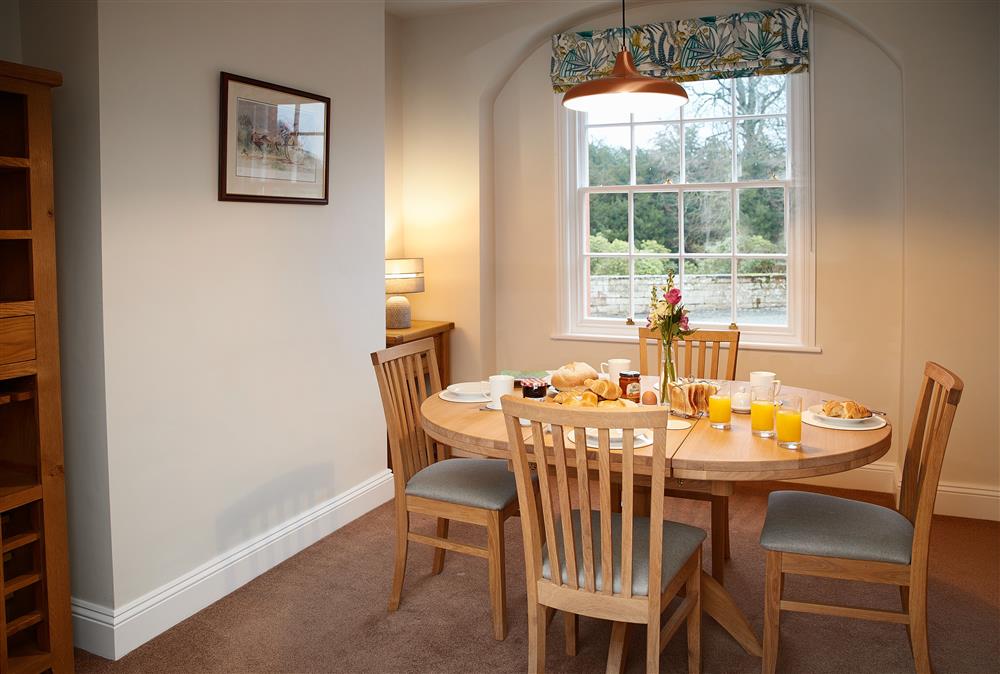 Dining room with seating for four guests at Coach House, Netherby Hall, Longtown