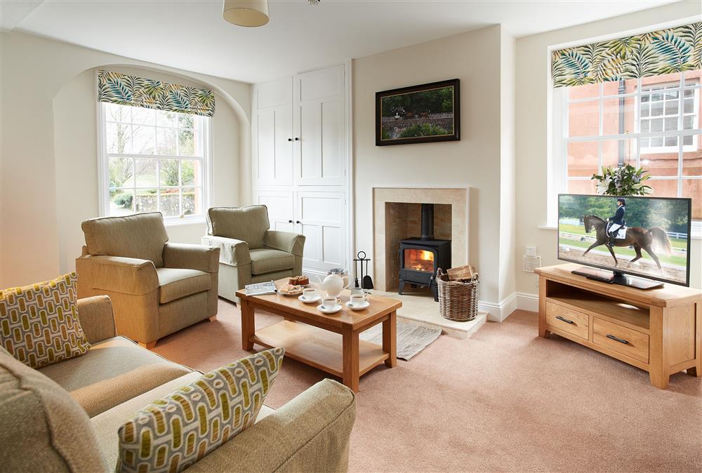 Relax in the elegantly styled sitting room at Coach House, Netherby Hall, Longtown