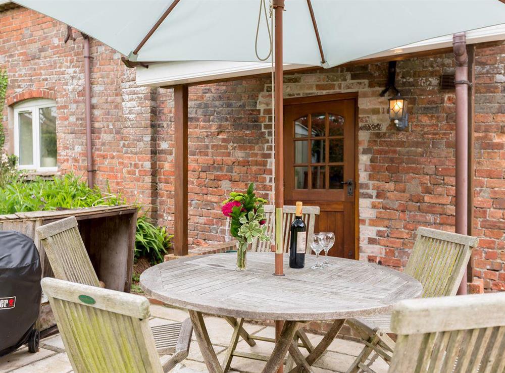Outdoor dining area at Coach House in Wareham, Dorset., Great Britain