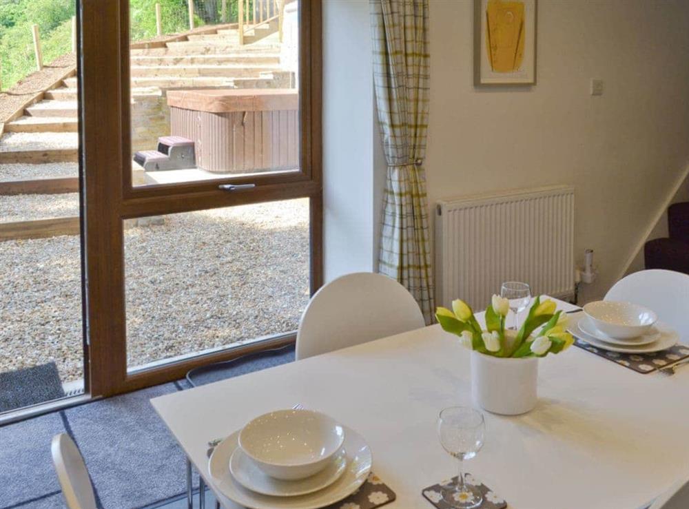 Kitchen diner with access to courtyard at Coachmans Cottage in Fernilee, near Whaley Bridge, Derbyshire