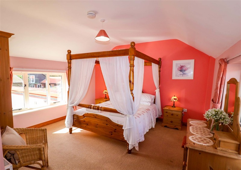 A bedroom in Coachman's Cottage at Coachmans Cottage, Ipswich