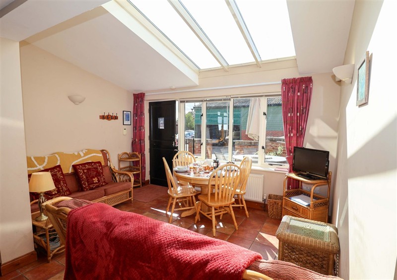 Relax in the living area at Coachmans Cottage, Ipswich
