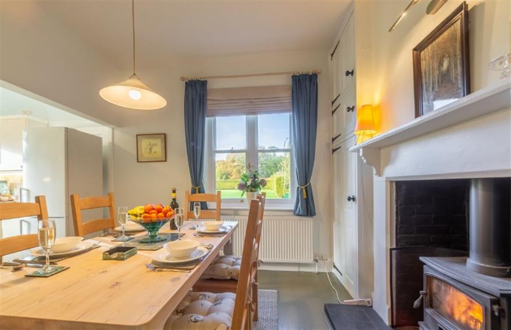 Ground floor: Light the wood burning stove when days are chilly at Coachmans Cottage, Old Hunstanton