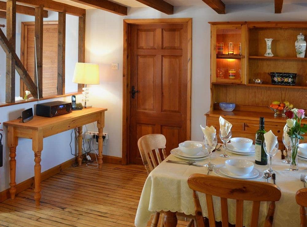 Open plan kitchen/dining space provides a social space in which to enjoy a family meal at Coachmans Cottage in White Cross, near Newquay, Cornwall