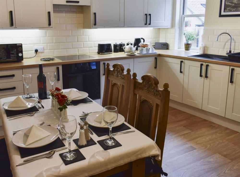 Well-equipped kitchen and dining area at Coachmans House in Whitby, Yorkshire, North Yorkshire