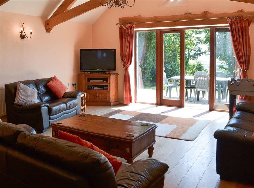 Spacious airy open plan living area with access to the patio at Coachmans Retreat in Pennytinney, St Kew., Cornwall