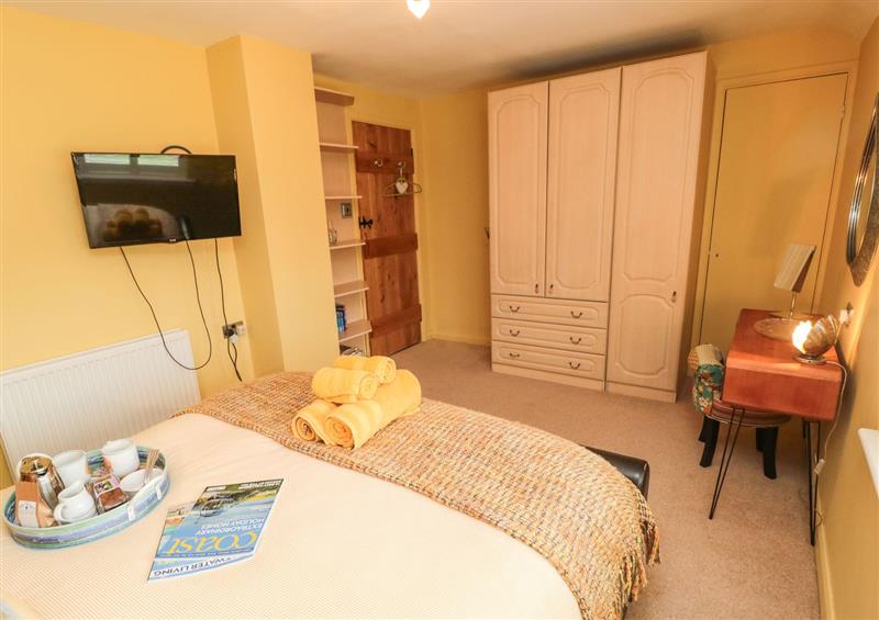A bedroom in Coast Cottage at Coast Cottage, Bamburgh