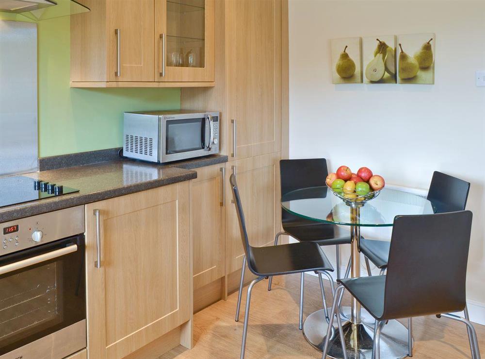 Convenient dining area in well-equipped fitted kitchen at Coastal Retreat in Beadnell, Northumberland