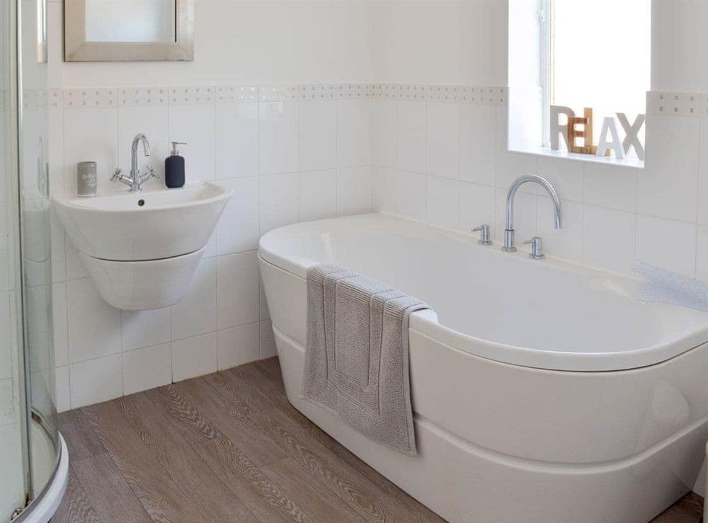Bathroom with bath and separate shower cubicle at Coasters Retreat in Bridlington, North Humberside