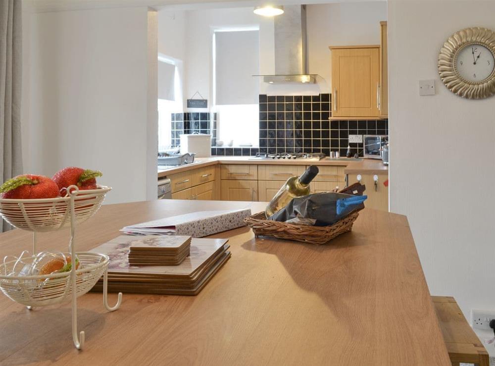 Dining area with open aspect to kitchen at Coasters Retreat in Bridlington, North Humberside