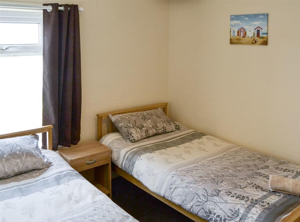 Comfortable twin bedroom at Coastguard Cottage in Caister-on-Sea, near Great Yarmouth, Norfolk