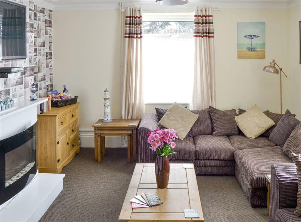 Welcoming living room at Coastguard Cottage in Caister-on-Sea, near Great Yarmouth, Norfolk