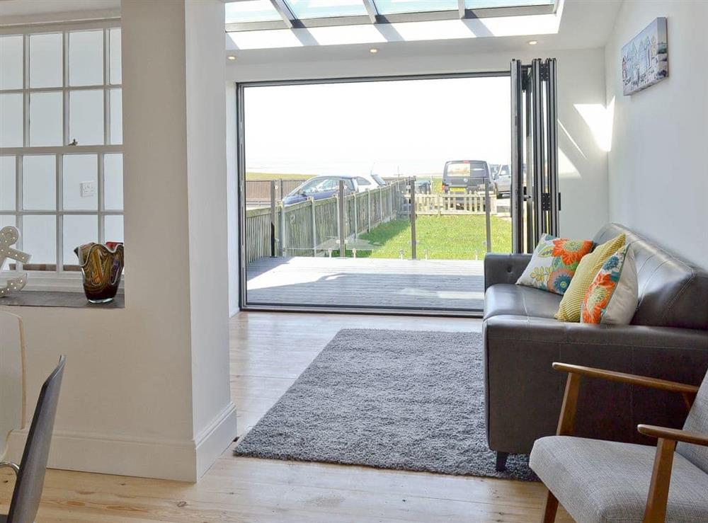 Living area, leading through to the bi-folding doors and the views beyond at Coastguard Cottage in Swalecliffe, near Whitstable, Kent