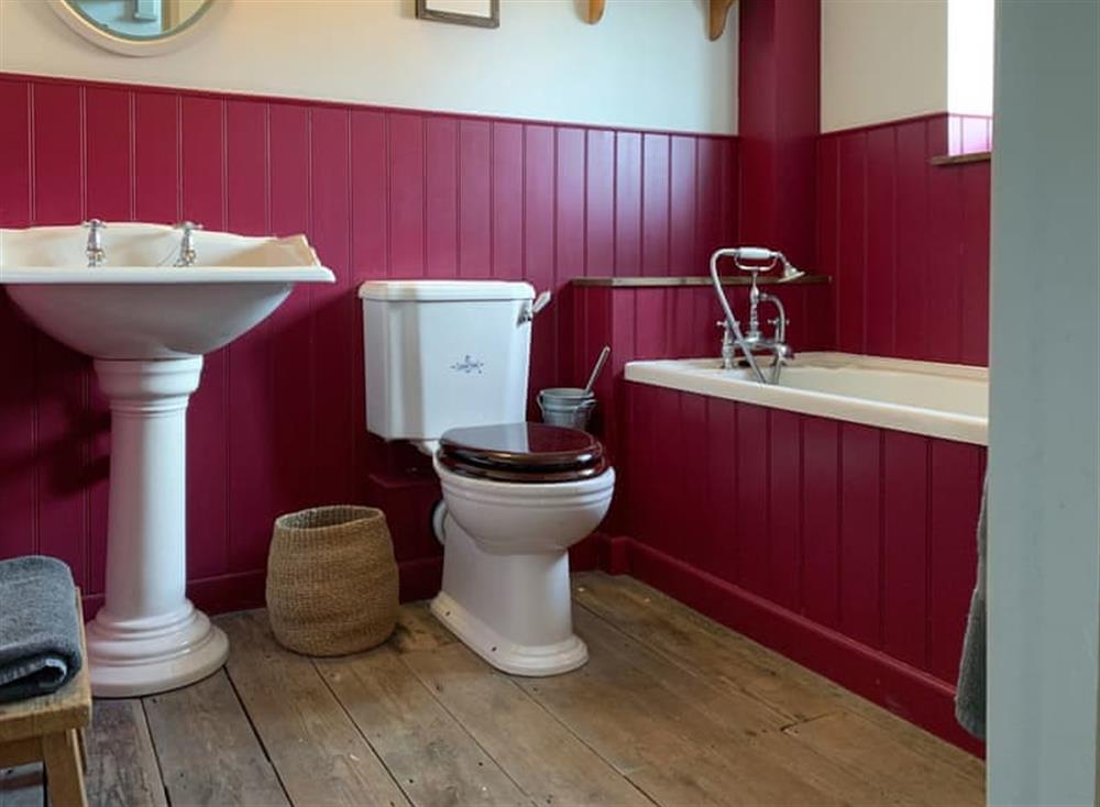 Family bathroom with heated towel rail at Coastguards Cottage in Burnham Overy Staithe, near Burnham Market, Norfolk