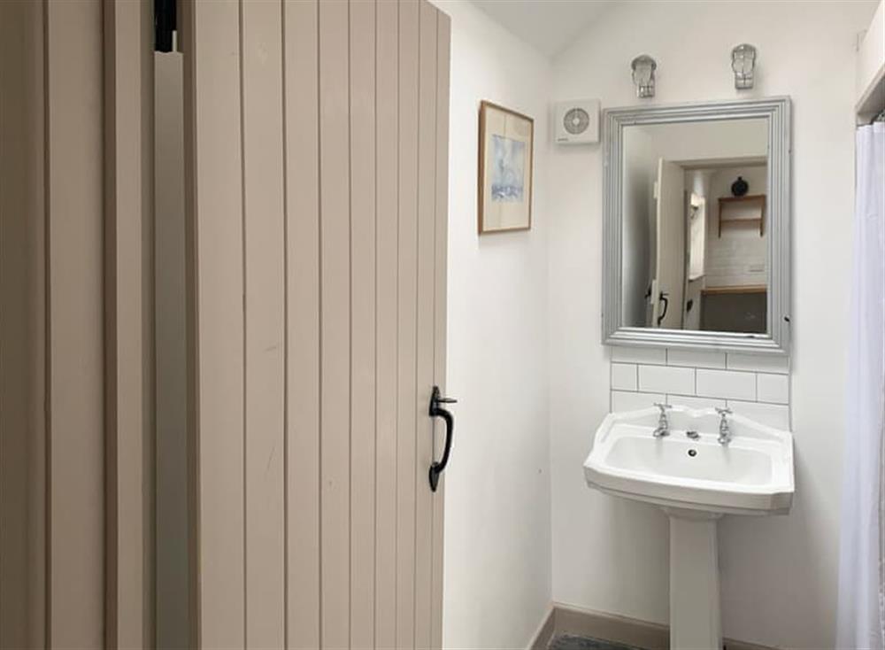 Shower room within converted outhouse at Coastguards Cottage in Burnham Overy Staithe, near Burnham Market, Norfolk