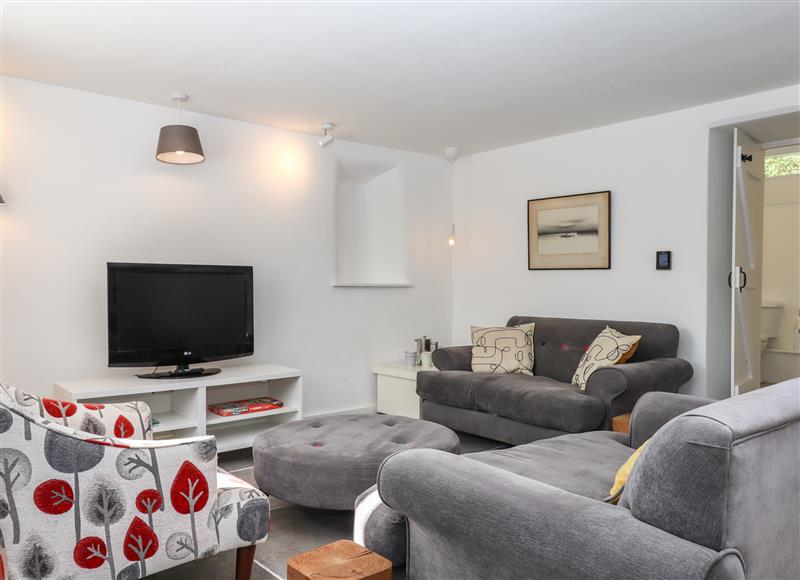 Relax in the living area at Cob Cottage, Liverton near Bovey Tracey
