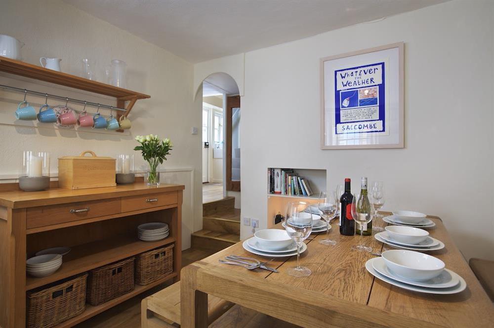 Dining table comfortably seating 6 people at Cob Cottage in , Salcombe