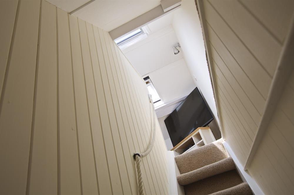 Narrow stairs leading to a cosy snug at Cob Cottage in , Salcombe