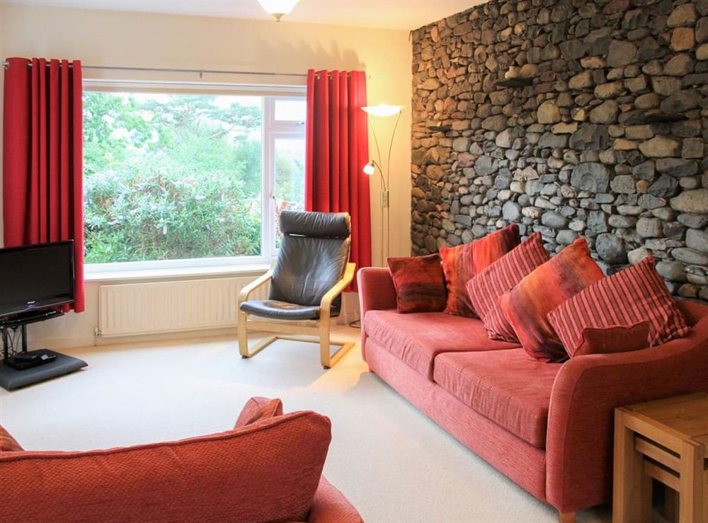 Spacious living room with feature exposed stone wall at Cobble Rigg in Threlkeld, near Keswick, Cumbria