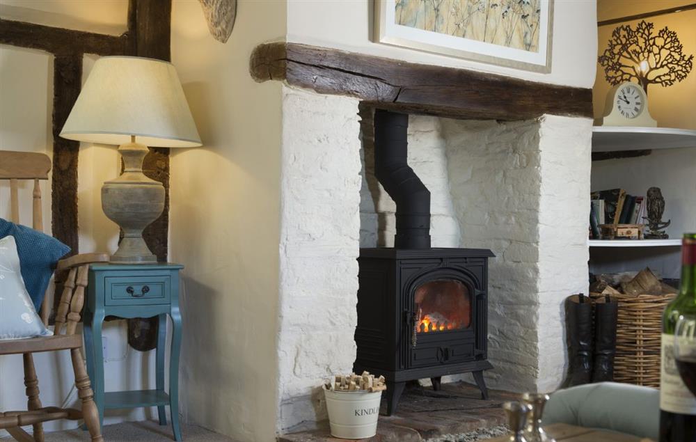 Sitting room with wood burning stove at Cobblers Cottage, Pembridge