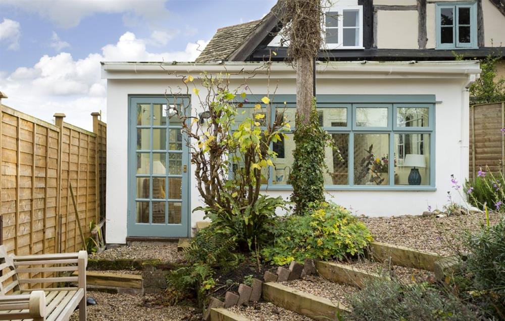 The conservatory opens on to an attractive pebbled garden at Cobblers Cottage, Pembridge