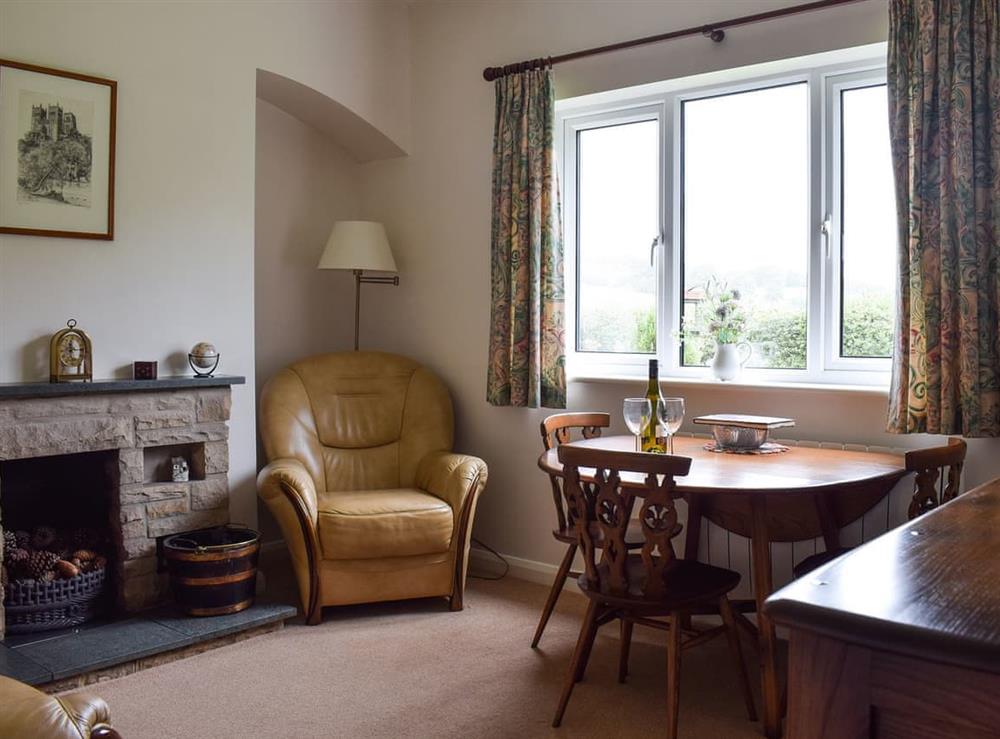 Living room with dining area at Cobbs Cottage in Grosmont, near Whitby, North Yorkshire