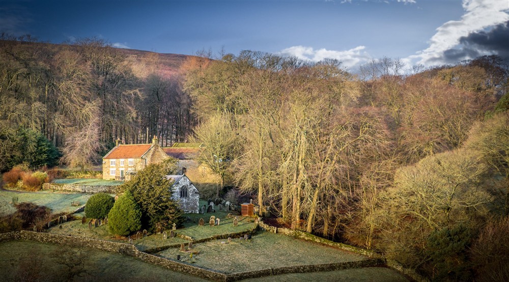 An aerial view of Cockayne Cottage and the churchyard next door in winter, Yorkshire at Cockayne Cottage in York, North Yorkshire