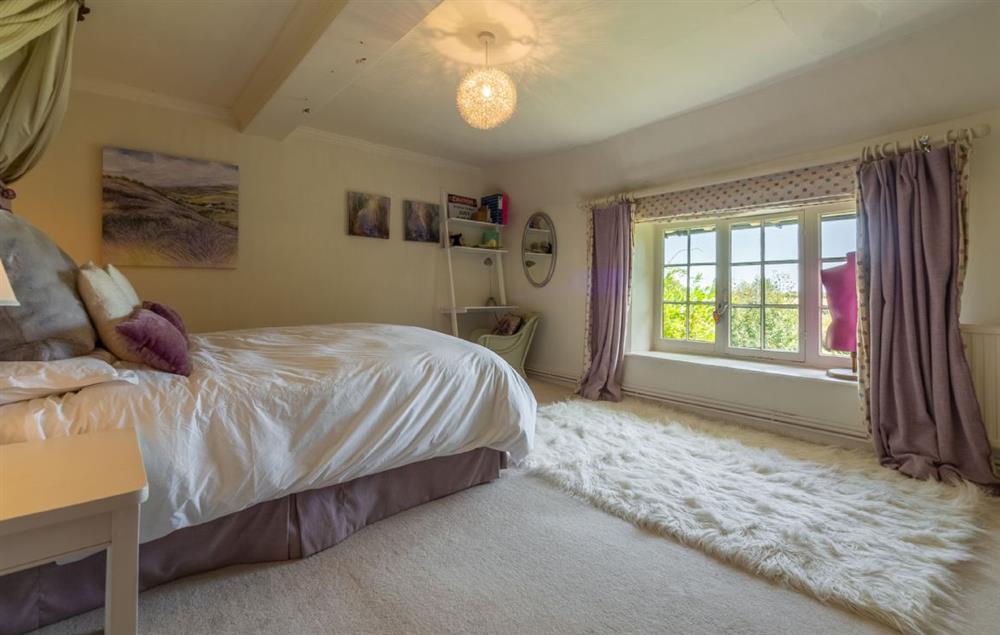 Bedroom four with double bed at Cockerells Hall, Buxhall