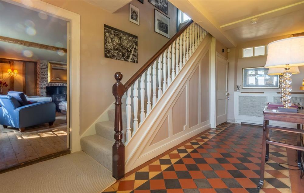 Hallway with stairs to first floor at Cockerells Hall, Buxhall