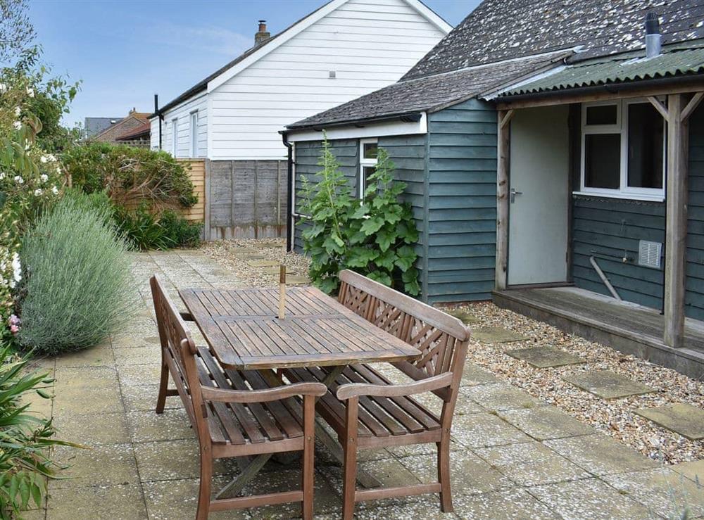 Paved patio area ideal for alfresco entertaining at Cockle Cottage in Elmer, near Middleton on Sea, West Sussex