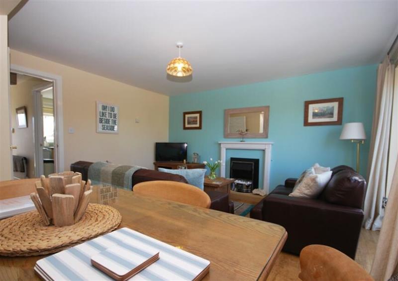 Relax in the living area at Cockle Cottage, Seahouses